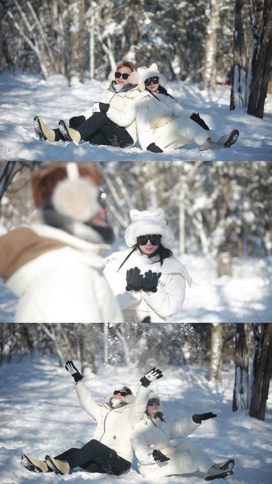 Two customers in rented winter jackets in the snow 两位顾客身穿租借的冬季外套